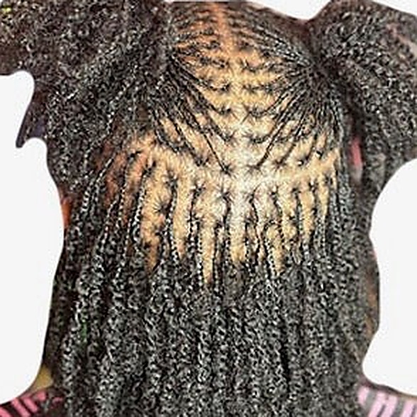 Micro locs hanging past the shoulders.